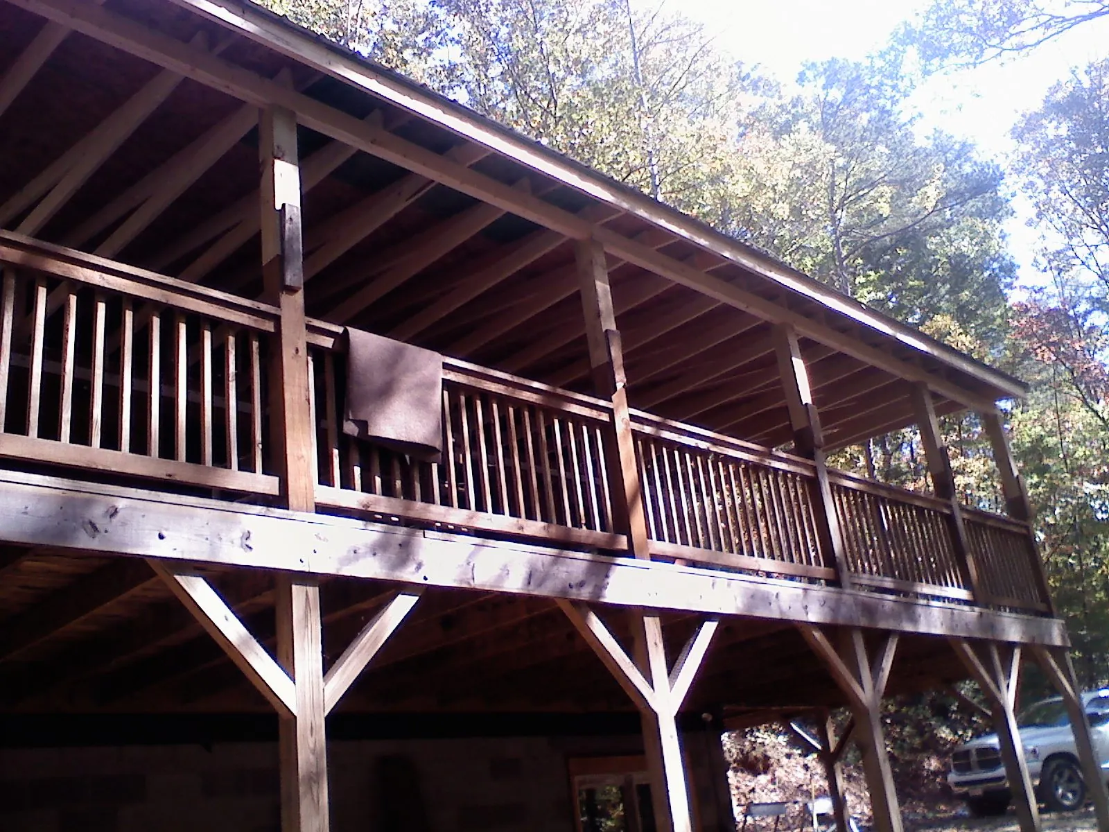 Timber framing under a new elevated porch and deck — Roof Leak Repair in West Branch by Roofing Brothers